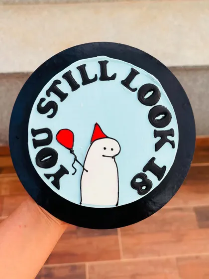 A funny meme cake that says "You still look 18". These trendy Flork meme cakes are a great way to share a laugh on a birthday.
