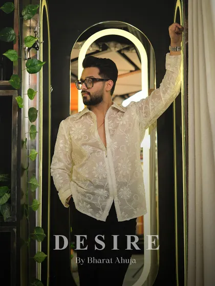 Another full-length view of the sheer floral shirt, a piece that blends elegance and edge perfectly.