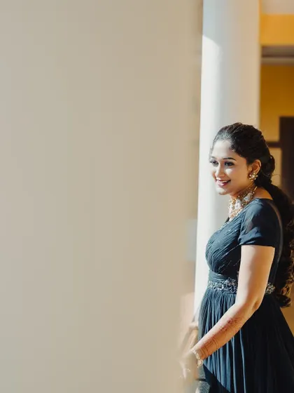 A beautiful, naturally lit photo of the bride. Her smile is radiant.