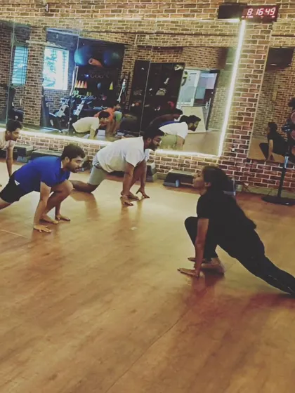 Another angle of the low lunge pose, highlighting the alignment and form we emphasize in our yoga instruction.