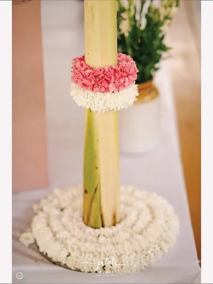 Another detail from the ritual decor, showcasing the beautiful combination of tuberose, lotus, and a sacred Kalasa.