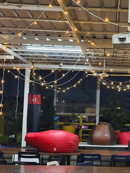 We made sure the entire recreational area at the Bizom office was part of the festive fun. This view shows the lighting above the casual seating area with bean bags and a projector, making it a perfect spot for an office holiday movie screening.