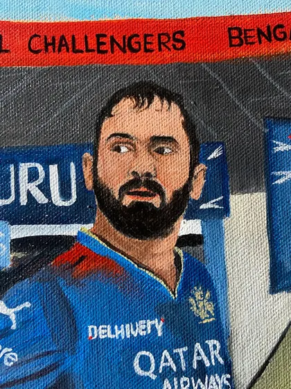 A close-up on DK's face in the portrait, capturing his focused look.