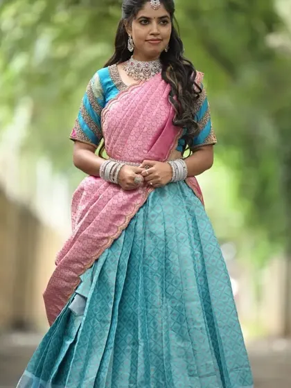 This stunning turquoise and pink silk Langa Davani is one of my most popular rentals. The rich fabric and beautiful color contrast make it a standout outfit for weddings or engagements.