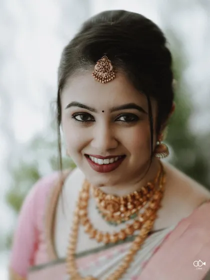 A beautiful, smiling close-up of the bride, her happiness radiating from the image.