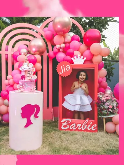 For a Barbie-themed party, I created a life-sized Barbie box for the birthday girl to pose in. The area was decorated with a pink rainbow arch and balloon garlands in various shades of pink.