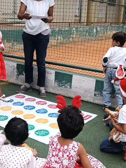 A game of Twister at the Christmas carnival adds a fun physical challenge. It's a great way to learn colors, right and left, and body awareness.