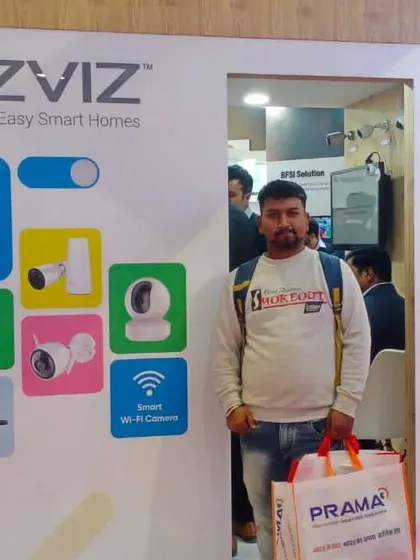 Visiting the EZVIZ booth at a recent trade show. I make it a point to get hands-on experience with the smart home security products I recommend and install.
