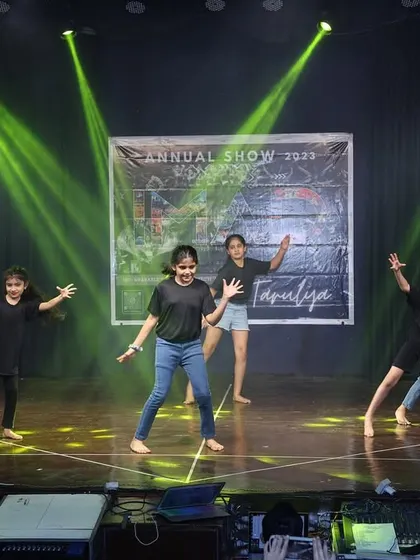 The teens move with energy and precision in this modern dance number.