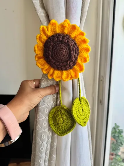 Here is one of my sunflower curtain tiebacks in action. It adds such a lovely, handmade touch to the room.