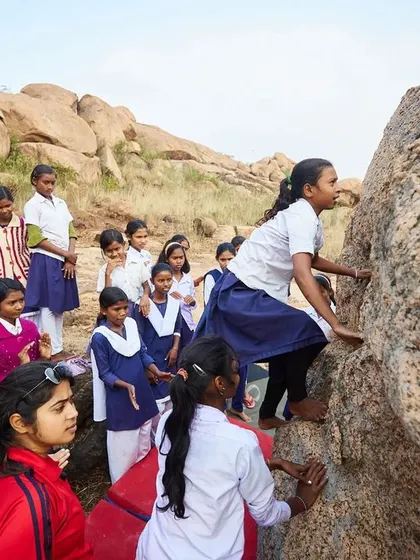 A duplicate of 129, this powerful image shows a young girl discovering her own strength and capability on the rock.