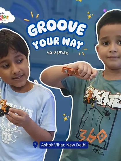 Groove your way to a prize! Our arcade games are full of excitement, and these two friends are showing off the cool keychains they won.