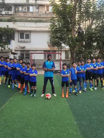 Presenting the football team of HB Sports. Lined up on the turf with their coach, these players embody the passion, power, and performance that our academy stands for.