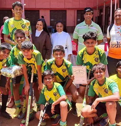 The team celebrating their championship at the Durello Convent tournament.