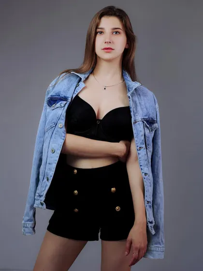 A front-facing version of the same look, with the model making direct eye contact. This is a strong, confident shot for any model's book.