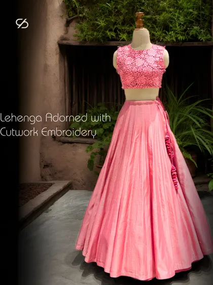 My pink lehenga, adorned with intricate cutwork embroidery, is a beautiful fusion of contemporary style and traditional craftsmanship.