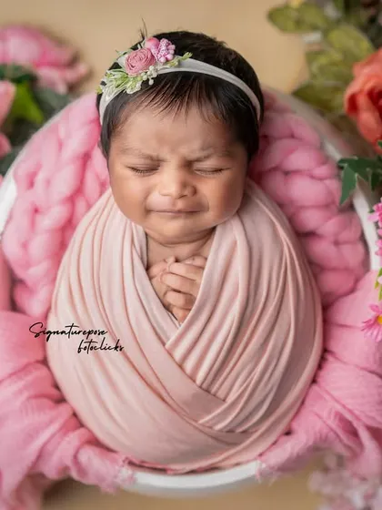 A duplicate of image 142, a cute and expressive newborn moment.
