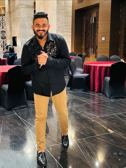 A smile of anticipation before the party starts. I'm excited to bring the energy and make this sangeet night unforgettable.