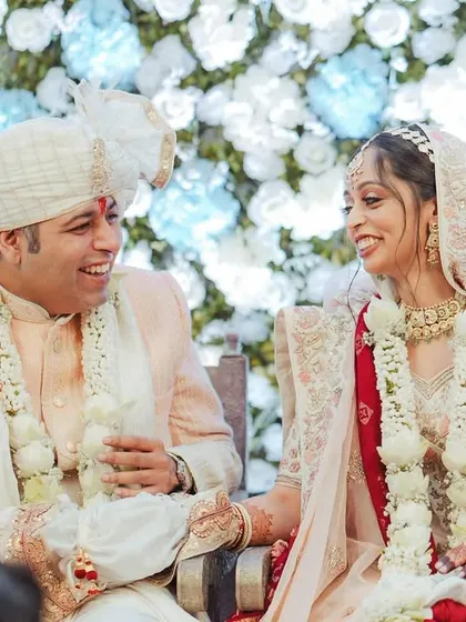 The moment it sinks in. A beautiful, candid laugh shared between the newly married couple during their ceremony.