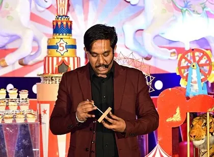 A circus themed birthday party is the perfect place for magic. Here I am performing a close-up trick on stage, making the birthday celebration extra special.