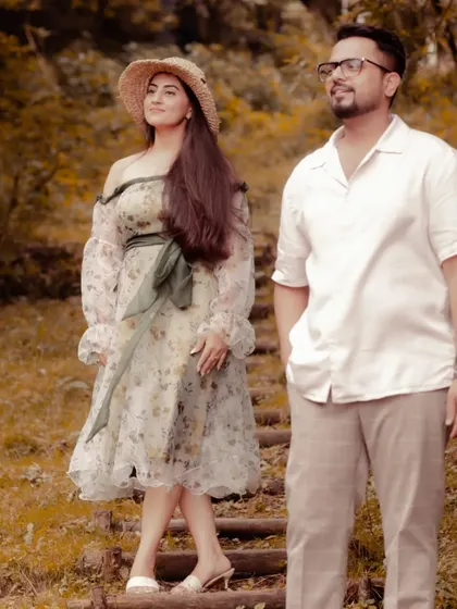 This look was designed for a rustic, nature-themed pre-wedding shoot. I created a custom floral organza dress with off-shoulder puff sleeves, paired with a straw hat for a touch of countryside charm.