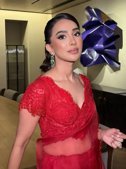 The power of a bold lip and defined eyes. This close-up on Nayana shows how a few key elements can create a truly stunning and memorable evening look.