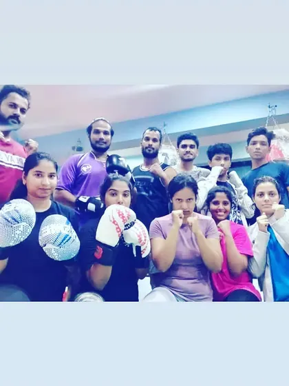 Our tribe is diverse, with men and women of all ages and fitness levels. Here, a group of our female members are ready for their boxing drills. Everyone is welcome, everyone trains hard.