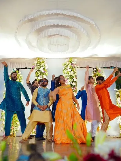 The grand finale of a group performance, with everyone striking a pose. We ensure every dance ends on a high note.
