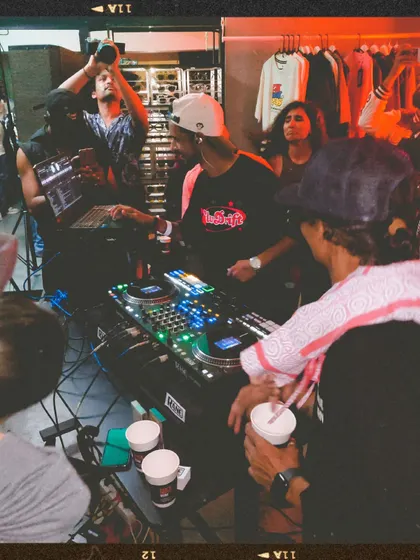 A view from behind the decks, showing the crowd and my collaborator DJ Johney. The energy at the first Slw Drift party was amazing.