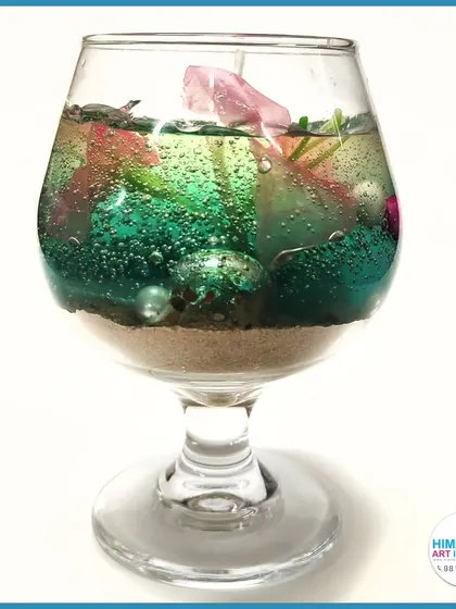 A multi-colored gel candle in a wine glass, perfect for decoration. Our classes cover how to use various containers for your candle making projects.