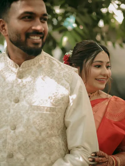 A candid shot capturing the couple's genuine smiles and easy-going interaction.