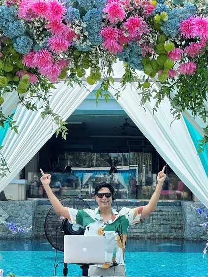 Ready to kick off a summer pool party. The floral decor, the poolside setup, and a playlist full of sunny vibes are all in place for a perfect daytime celebration.