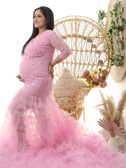 Blooming in pink. This full-length shot shows the incredible volume and detail of the pink ruffled gown, creating a fairy-tale-like image.