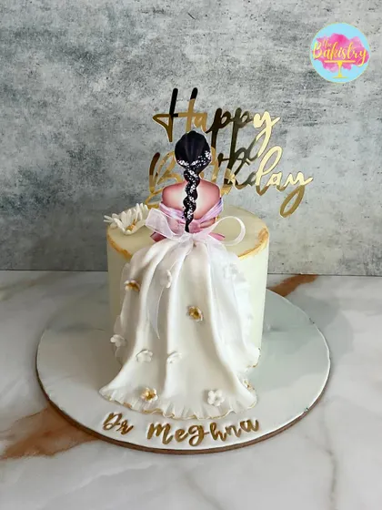 A unique design where the dress is made from delicate fondant draping. This cake for Dr. Megha features a 2D print of a girl with a beautifully crafted flowing gown.