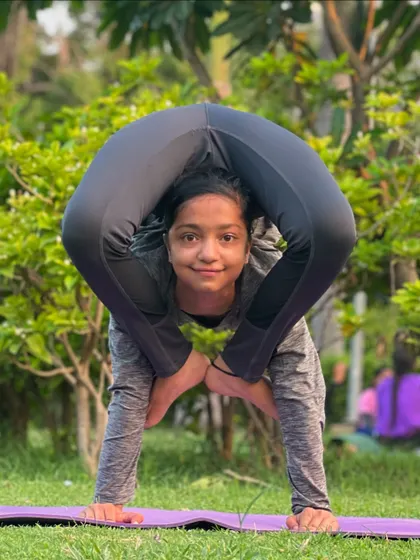 Another look at this incredible backbend pose. The student's calm face and steady gaze show the focus that comes with deep practice.