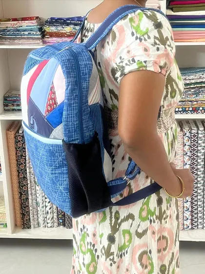 A side view of the backpack, showing the comfortable straps and side pockets.