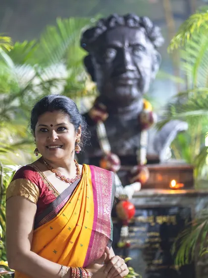 Posing in front of a statue of the great Kannada poet Kuvempu. This image connects my love for fashion with my cultural roots.
