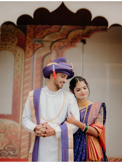 A tender moment between the newly married couple. The bride resting her head on the groom's shoulder shows their new bond as husband and wife.