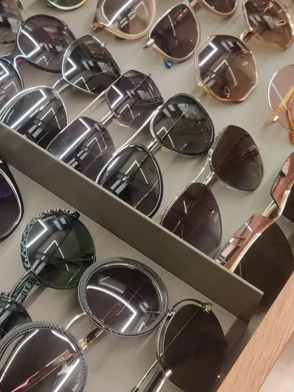 A drawer full of sunglasses, neatly organized and ready to wear. Using drawer dividers or trays prevents scratches and makes it easy to pick the perfect pair to match your outfit.