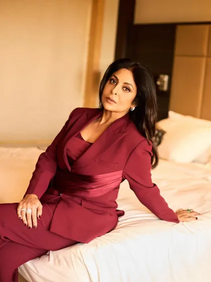 Another angle of the maroon suit, highlighting its clean lines and the beautiful tailoring.