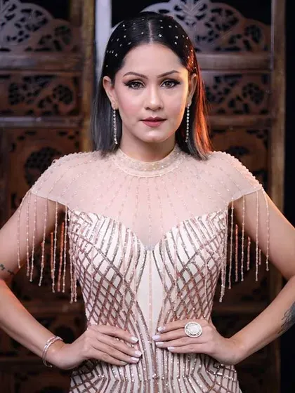 A confident, front-facing pose. The makeup enhances her features, making her look and feel like the star of the evening.
