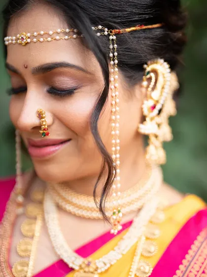 A detailed shot of the eye makeup and traditional jewellery. I used soft brown and gold tones to create a look that is warm and enhances her features without being heavy.
