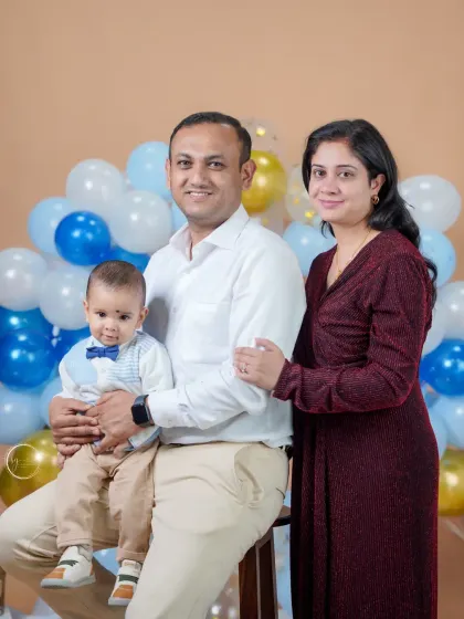 A formal family portrait from a first birthday session. Even during a fun celebration, we take time to capture a more classic portrait that you can hang on your wall for years to come.
