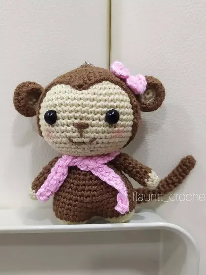 Even a monkey wants a little Barbie charm! This custom-made monkey features a cute pink bow and scarf. I love personalizing toys to match your ideas.