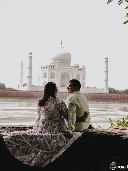 A romantic shot from behind the couple as they gaze at the Taj Mahal. This perspective invites the viewer into their private moment, sharing in their admiration for both the monument and each other.