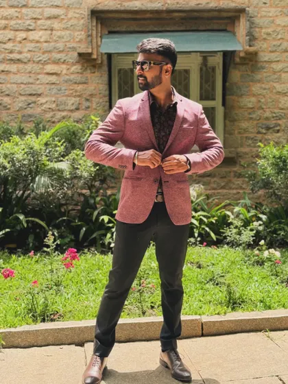 A full-length shot showing my formal attire. It's important to match the event's dress code while maintaining my personal style.
