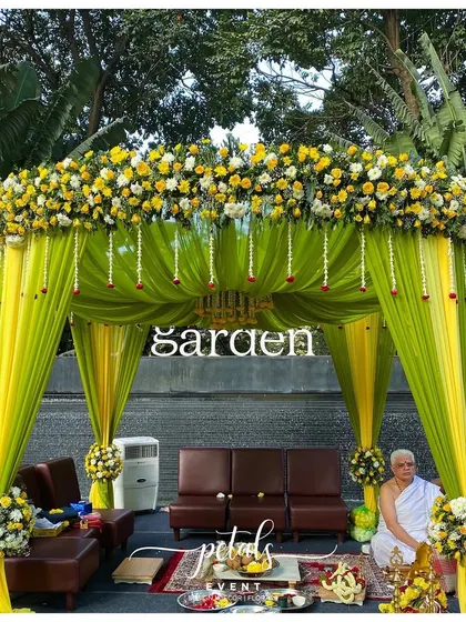 A full view of the Telugu wedding mandap, showcasing the beautiful contrast of green and yellow. The design is fresh, modern, and perfectly suited for a joyful celebration of love and tradition.