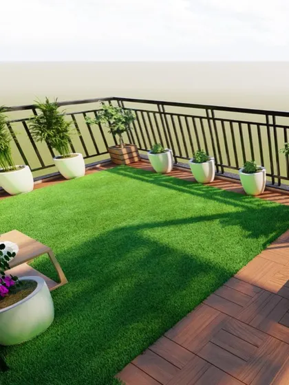This design shows how we can use a combination of artificial turf and wooden decking to create different zones and visual interest, even in a compact balcony space.