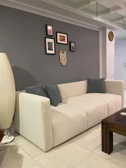 This shot captures the sofa in its intended environment, providing comfortable and stylish seating.
