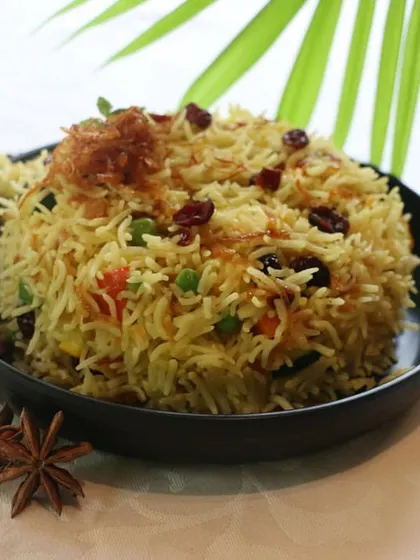 Enjoy a bowl of my fragrant Zaffrani Pulav. This rice dish is delicately spiced with saffron and other aromatics, and studded with nuts and berries for a touch of sweetness.